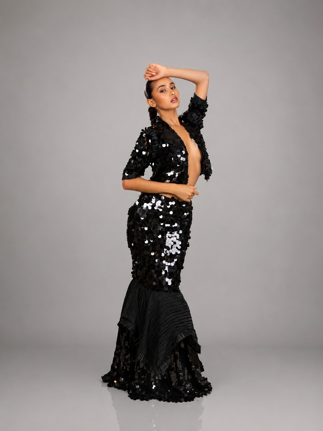 Model in Midnight Muse posing in profile against a pale studio backdrop